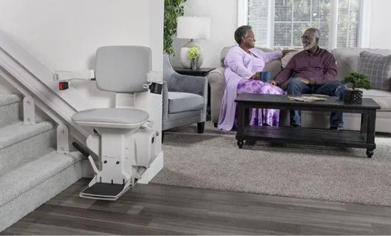 stair lift with family sitting behind in the living room