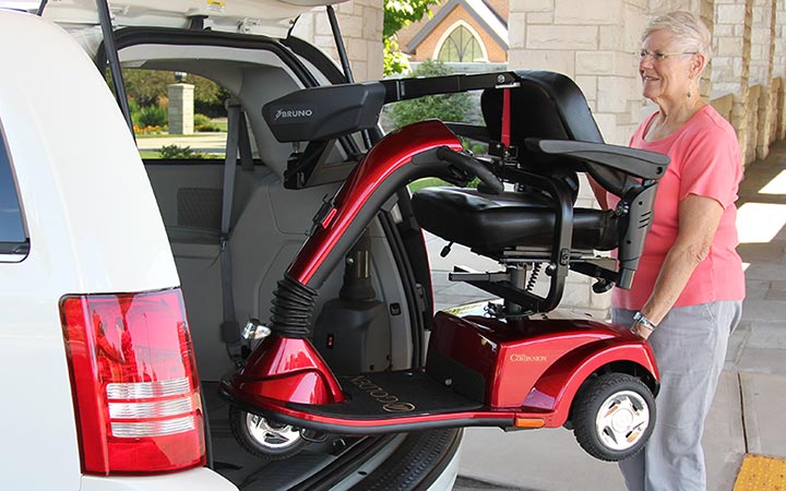 Bruno Curb-Sider Scooter Lift being loaded into back of van